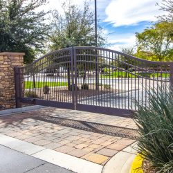Wrought Iron Security Gate With Rock Columns Holzer Commercial Doors, Automatic Gates, Swinging Gates, Sliding Gates, Controls, Custom Gates, repair and service, security gates
