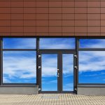 Glass door and windows with sky reflections of new no name office in the modern mass production building. Collage from several photos. Glass isolates with patch Holzer Commercial Doors, Glass Aluminum Storefront Doors, Windows, Hardware, Service and Repair, Glass